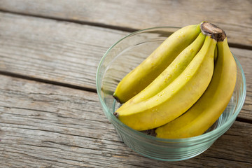 Wall Mural - Close-up of fresh bunch of bananas in bowl