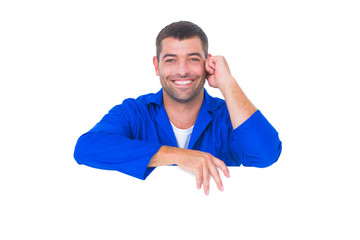 Poster - Handsome mechanic with blank placard