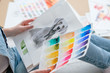 © golubovy - creative art lifestyle. drawing hobby and self expression. woman looking at picture of a dog and color swatches