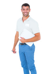 Poster - Smiling male handyman with clipboard and pen on white background