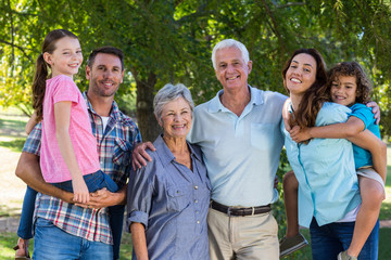 Wall Mural - Extended family smiling at the camera