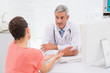 © WavebreakmediaMicro - Patient consulting a serious doctor