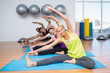 © WavebreakmediaMicro - People exercising on mats in fitness club