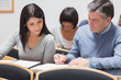 © WavebreakmediaMicro - Man showing woman something on notepad