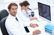 © ASDF - Young male technician working on computer in laboratory