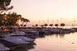 Beautiful view with sunset boats and Garda lake, Italy