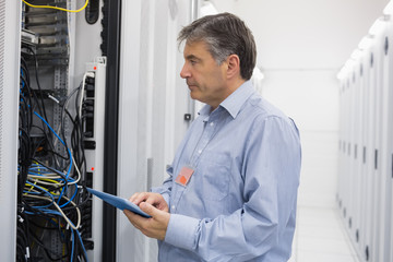 Aufkleber - Man using tablet for maintenance on servers