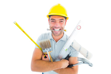Poster - Portrait of smiling handyman holding various tools