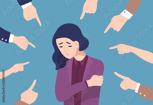 Fotografía Sad or depressed young woman surrounded by hands with index fingers pointing at her
