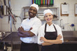 © WavebreakmediaMicro - Two chefs standing with arms crossed in the commercial kitchen