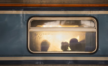 Silhouettes Of Passengers In Old Train Wagon