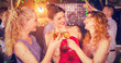 © vectorfusionart - Female friends toasting glasses of champagne against flying colours