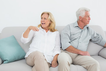 Displeased relaxed senior couple at home