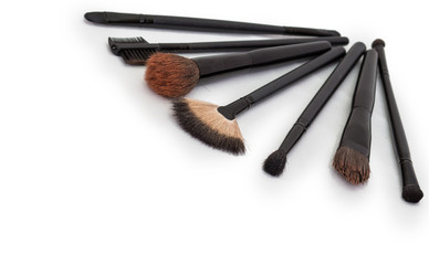 makeup brushes on isolated white background