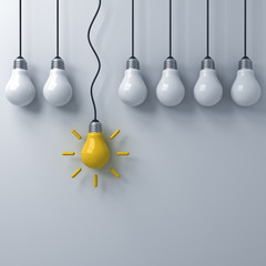 Aufkleber - Think different concept , One hanging yellow idea bulb standing out from the dim unlit light bulbs on white wall background , leadership and individuality creative idea concepts . 3D rendering.