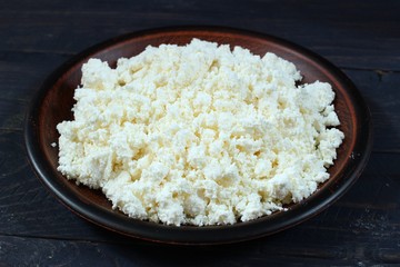 Poster - curd in bowl on dark wooden background