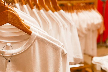 Wall Mural - Blank white t shirts on hangers in the shopping mall