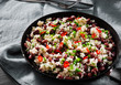 rice with red beans and vegetables in a frying pan