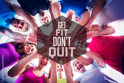 Motivational new years message against people stacking hands at health club Poster