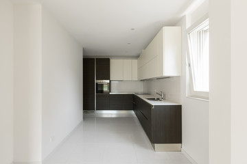  Dark minimal kitchen in a modern apartment