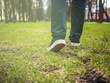 © Mihail - close up foot steps on the grass