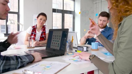 business, technology and people concept - creative team or designers with computers working on user interface at office