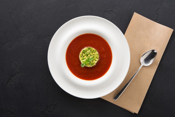 Wall Mural - Cold tomato soup gazpacho with avocado copy space