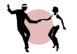 Silhouettes of young couple dancing
