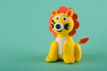 Cute toy lion made of moddeling clay