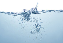 Blue Water Surface With Splash And Air Bubbles On White Background