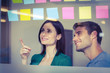© WavebreakmediaMicro - Colleagues looking at sticky notes