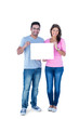 © WavebreakmediaMicro - Smiling friends holding blank sign together