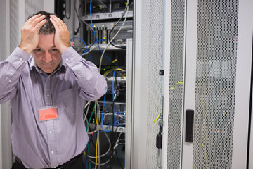 Aufkleber - Man looking weary of data servers