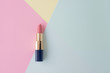 Flat lay of creative female cosmetic for pink lipstick on the colorful background with copy space