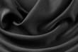 Schwarzes Tuch Seide Struktur Edel Stoff Gewebe Material mit seidiger Textur Macro Closeup Hintergrund