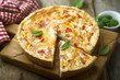 Savory pie with cheese, bacon and vegetables