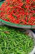 Red and green chillis in a basket