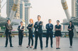 © thithawat - business people group of teamwork diverse team standing at outdoor in modern city. business team leader powerfull successful concept.