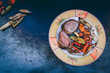 Gegrilltes Schweinefilet im Baconmantel mit BBQ Grillgemüse von der Feuerplatte