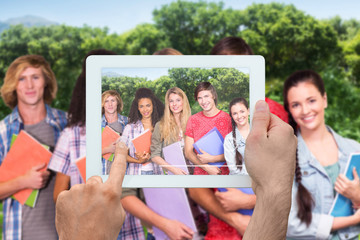 Poster - Hand holding tablet pc against park on sunny day