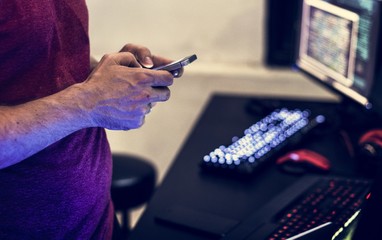 Man sitting using mobile phone