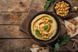 healthy homemade chickpea hummus with olive oil and smoked paprika,