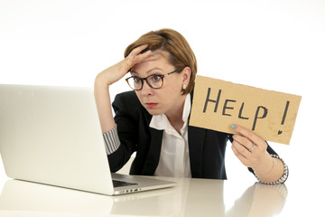 Attractive young overwhelmed and frustrated business woman working on her computer asking for help