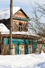 Wall Mural - snow-covered old urban wooden house in Suzdal