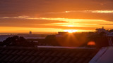 Fototapeta Miasto - Sunset Over The Roofs