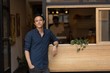 © Wavebreak Media - Portrait of man standing outside cafe