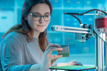 young woman design printing of the metamaterials on a 3d printer