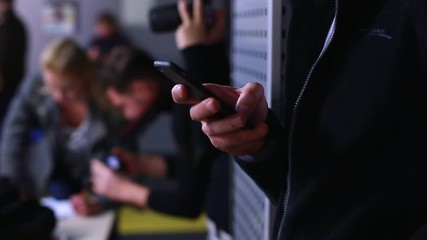 Closeup of young man hands typing sms scrolling pictures phone. HD. 1920x1080