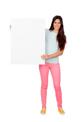 Wall Mural - Brunette girl with pink pants holding a blank poster