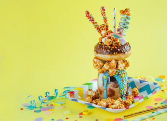 Wall Mural - Freak shake on the yellow background with blank space for text